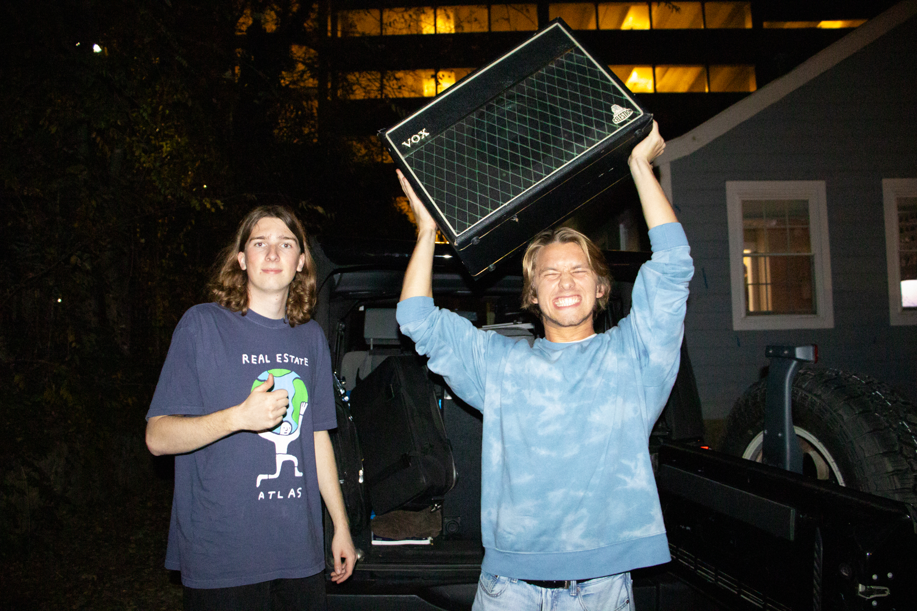 James Dudek and John Fleischer unload the car for a house show with their band, Red Kanoo.