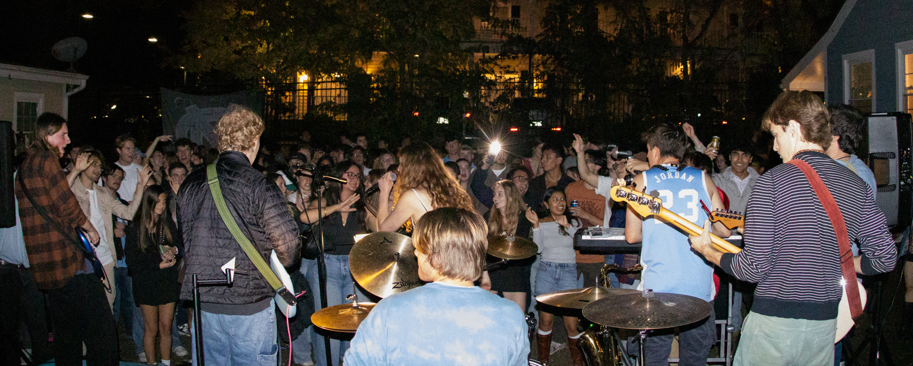 photo of UNC student band, Red Kanoo, playing a house show.